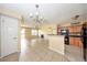 Open-concept living room with ample natural light and view to the kitchen at 420 Forestway Cir # 206, Altamonte Springs, FL 32701