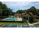 Community pool with spa, sun loungers, and lush landscaping surrounding the recreational area at 420 Forestway Cir # 206, Altamonte Springs, FL 32701