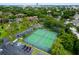 Aerial view of community tennis courts surrounded by lush greenery and convenient parking at 420 Forestway Cir # 206, Altamonte Springs, FL 32701