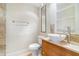 Bathroom featuring toilet, sink, mirror, tile accent wall, and ample space at 4300 Lake Underhill Rd # D, Orlando, FL 32803