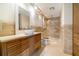 Modern bathroom with stone tile, walk-in shower, floating vanity, and vessel sink at 4300 Lake Underhill Rd # D, Orlando, FL 32803
