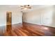 Bedroom featuring hardwood floors, ceiling fan, and dual door closet at 4300 Lake Underhill Rd # D, Orlando, FL 32803