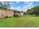 Spacious lawn and well-maintained brick apartment buildings create a beautiful community ambiance at 4300 Lake Underhill Rd # D, Orlando, FL 32803
