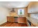 Modern kitchen with stainless steel appliances, granite counters, and wooden cabinets at 4300 Lake Underhill Rd # D, Orlando, FL 32803