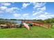 Lakeside recreation: Canoes and boats await by the wooden dock, offering scenic lake adventures at 4300 Lake Underhill Rd # D, Orlando, FL 32803