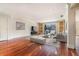 Inviting living room featuring hardwood floors, natural light, a modern entertainment center, and comfortable seating at 4300 Lake Underhill Rd # D, Orlando, FL 32803
