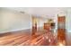 Open-concept living room featuring hardwood floors, neutral walls, and ample natural light at 4300 Lake Underhill Rd # D, Orlando, FL 32803
