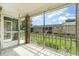 Relax on the screened patio offering outdoor living and serene views of the well-manicured community at 4300 Lake Underhill Rd # D, Orlando, FL 32803