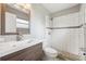 Updated bathroom features a modern vanity, toilet and tiled shower with glass doors at 510 Peach Tree Ln, Altamonte Springs, FL 32701