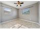 Bedroom features tile floors, a ceiling fan, and window for natural light at 510 Peach Tree Ln, Altamonte Springs, FL 32701