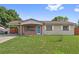 Charming single-story home with a cozy carport, brick accents, and a well-maintained front lawn at 510 Peach Tree Ln, Altamonte Springs, FL 32701