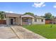 Charming single-story home with a brick facade and well-maintained lawn at 510 Peach Tree Ln, Altamonte Springs, FL 32701