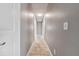 Clean hallway with tile flooring, neutral paint, and recessed lighting leading to various rooms at 510 Peach Tree Ln, Altamonte Springs, FL 32701