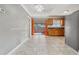 Open-concept kitchen with wood cabinets, stainless steel appliances, and tile floors at 510 Peach Tree Ln, Altamonte Springs, FL 32701