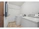 Practical laundry room featuring a side-by-side washer and dryer and durable tile flooring at 510 Peach Tree Ln, Altamonte Springs, FL 32701