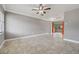 Bright living room showcasing tile floors, neutral paint, and sliding glass doors to the outdoors at 510 Peach Tree Ln, Altamonte Springs, FL 32701