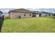 Expansive backyard with lush green grass, providing ample space for outdoor activities and enjoyment at 5416 Tessin Trl, St Cloud, FL 34771
