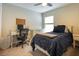 Comfortable bedroom with a desk, closet, and ample natural light at 5416 Tessin Trl, St Cloud, FL 34771