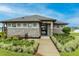 Beautiful clubhouse exterior with stone accents, manicured landscaping, and a welcoming walkway at 5416 Tessin Trl, St Cloud, FL 34771