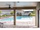 Inviting community pool with lounge chairs and a shaded area, perfect for relaxation and leisure at 5416 Tessin Trl, St Cloud, FL 34771