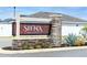 Attractive Siena Reserve community sign surrounded by well-maintained landscaping and greenery at 5416 Tessin Trl, St Cloud, FL 34771