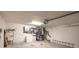 Spacious garage with ample storage, utility sink, and a garage door opener at 5416 Tessin Trl, St Cloud, FL 34771