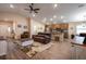 Open-concept living space with an eat-in kitchen, vaulted ceilings, and wood-look flooring at 5416 Tessin Trl, St Cloud, FL 34771