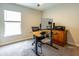 Office with large window, ceiling fan, and desk at 5416 Tessin Trl, St Cloud, FL 34771