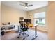 Office with ceiling fan, window, desk, and printer at 5416 Tessin Trl, St Cloud, FL 34771