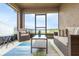 Screened-in patio with lake views, comfortable seating, and a decorative center table and rug at 5416 Tessin Trl, St Cloud, FL 34771
