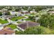 Expansive aerial view of neighborhood homes with well-maintained lawns and mature trees at 621 Bluebill Ln, Poinciana, FL 34759