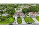 Aerial view of homes in community, featuring lush landscaping and manicured lawns at 621 Bluebill Ln, Poinciana, FL 34759