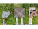 Bird's eye view of the property showcasing its roof, fenced yard, and landscaping at 621 Bluebill Ln, Poinciana, FL 34759