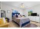 Bright bedroom featuring a plush bed with decorative pillows and abundant natural light at 621 Bluebill Ln, Poinciana, FL 34759