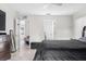 Bedroom with a dark comforter and views into other rooms of the house at 621 Bluebill Ln, Poinciana, FL 34759