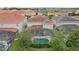 The home's private, screened-in pool and backyard are nestled among lush green trees at 7033 Oakwood St, Davenport, FL 33837