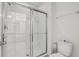 Clean bathroom with a glass-enclosed shower and modern fixtures at 7033 Oakwood St, Davenport, FL 33837