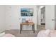 Bright bedroom featuring a TV, with an open doorway enhancing the room's spacious feel at 7033 Oakwood St, Davenport, FL 33837