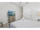 Bedroom featuring a comfortable bed, a TV, and ample closet space at 7033 Oakwood St, Davenport, FL 33837