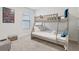 Neutral bedroom with a bunk bed and simple furnishings, offering a cozy and functional space at 7033 Oakwood St, Davenport, FL 33837