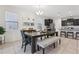 Dining area showcasing large table, stylish seating, and easy access to kitchen at 7033 Oakwood St, Davenport, FL 33837