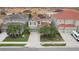 View of the property's exterior showing the roof with solar panels and a well-kept lawn at 7033 Oakwood St, Davenport, FL 33837
