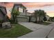 Charming home with a well-manicured lawn, mature trees, and a spacious driveway at 7033 Oakwood St, Davenport, FL 33837