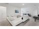 Open living room with sectional sofa and TV, ideal for Gathering gatherings and entertainment at 7033 Oakwood St, Davenport, FL 33837
