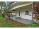Inviting covered back porch with access to fenced yard, perfect for outdoor relaxation at 714 28Th St, Orlando, FL 32805