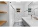 Bright bathroom featuring modern vanity, neutral paint, and glass enclosed shower and tub at 714 28Th St, Orlando, FL 32805