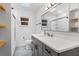 Bright bathroom features a white quartz vanity top and a shower and tub combo at 714 28Th St, Orlando, FL 32805