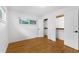 Bedroom with hardwood floors, white walls, a closet, and a window, providing a bright space at 714 28Th St, Orlando, FL 32805