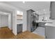 Updated kitchen boasts stainless steel appliances, gray cabinets, and hardwood floors at 714 28Th St, Orlando, FL 32805