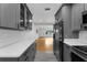 Stylish kitchen with sleek gray cabinets, quartz countertops, and stainless steel appliances, open layout at 714 28Th St, Orlando, FL 32805